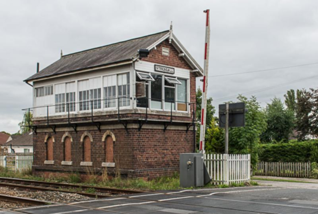 Railway signal box and rail crossing